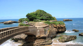 Bridge water island people walking - a bridge over a body of water free wallpaper for desktop