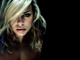 Serious blonde blueeyes portrait photorealistic - her face and shoulder free wallpaper