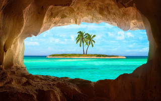 Tropical island cave view palm - in the ocean free wallpaper