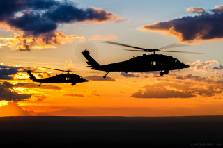 Military helicopters flying sunset clouds - the background and a sun setting free wallpaper