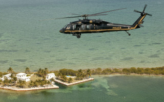 Helicopter flying small island ocean - a helicopter free wallpaper for desktop