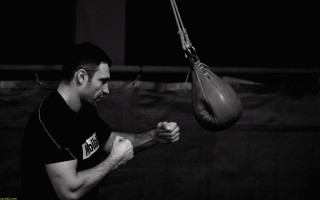 Man holding punching bag gym - dimitre manassiev mehandjiysky free wallpaper