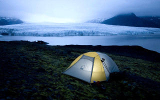 Tent grassy hill glacier lake - a tent free wallpaper