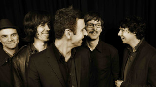 Men group black curtain background - a black curtain free wallpaper