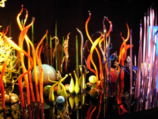 Glass blowing wands dark room - a curtain behind free wallpaper