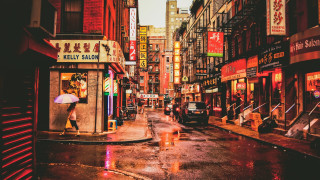 Wet city street person umbrella - an umbrella in the rain free wallpaper