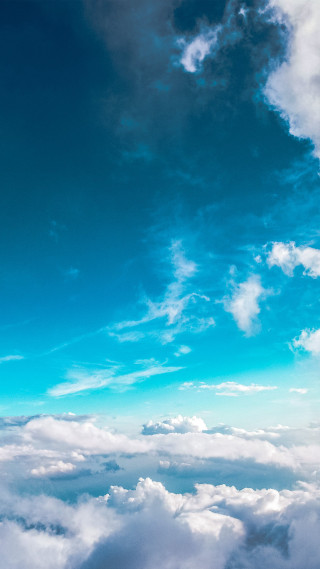 Plane flying high above clouds - above the cloud free wallpaper