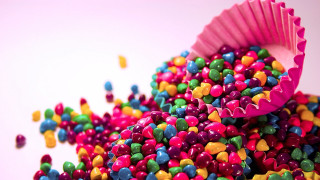 Colorful candy sprinkles white surface 3 - pastel free wallpaper