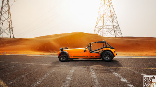 Orange car desert road power - an orange car free wallpaper