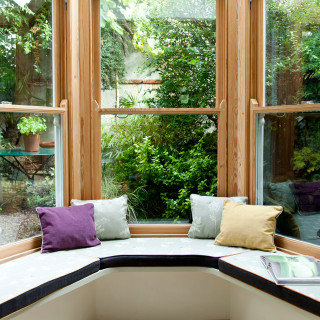 Corner window seat garden view - the table in front free wallpaper