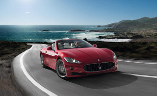Red masera driving ocean road - a road near the ocean free wallpaper