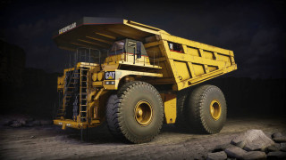 Large yellow dump truck night - a dirt road free wallpaper