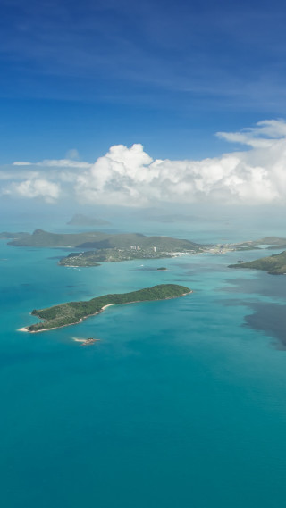 Aerial tropical island lagoons ocean - free mountains wallpaper