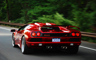 Red sports car driving road 8 - motion blur free wallpaper