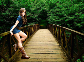 Woman posing bridge woods boots - her leg up free wallpaper