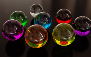 Colorful glass balls table black - a black surface free wallpaper