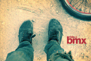 Person standing bike sidewalk tire - the ground behind them free wallpaper