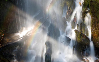 Waterfall rainbow man standing water - a waterfall free wallpaper