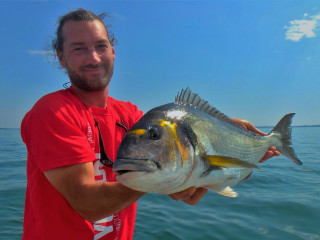 Man fish boat sky beach - lostfish free wallpaper for desktop