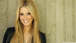 Woman blonde hair smiling wooden - a wooden wall behind her free wallpaper
