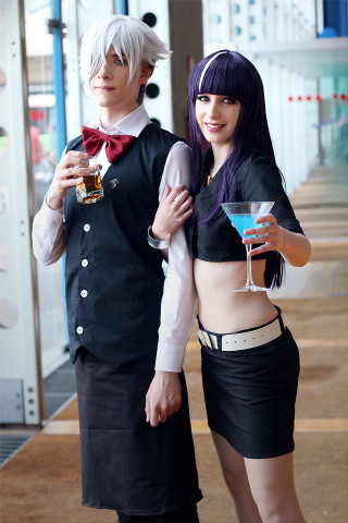 Costume party couple holding drinks - a man and a woman free wallpaper for mobile