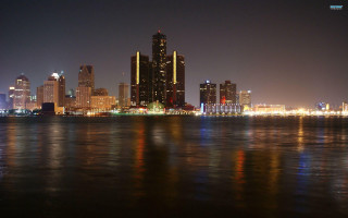 City skyline night water background 4 - a body of water in front free wallpaper