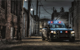 Police car dark alley night - a police car free wallpaper