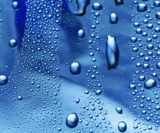 Water droplets blue surface sky 3 - a close up of water droplets free wallpaper