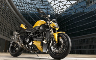 Yellow motorcycle parked building glass - a yellow motorcycle free wallpaper