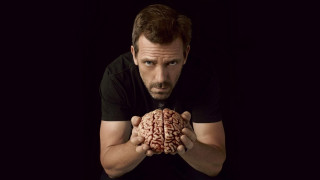 Man holding brain black background 3 - erlund hudson free wallpaper for desktop