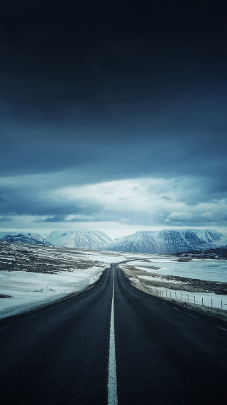 Long road clouds snow mountains - free mountains wallpaper for mobile