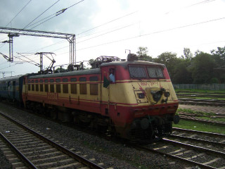 Train traveling tracks field grass - power free wallpaper