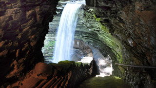 Waterfall cave stairs person view - inside free wallpaper