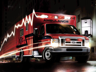 Red ambulance truck night street - sign free wallpaper