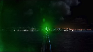Green light pier dark water - a green light free wallpaper