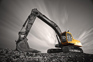Yellow black excavator rocky hill - a rocky hill free wallpaper