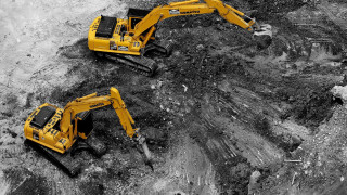 Black white yellow machines dirt - a dirt field free wallpaper