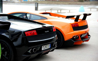 Orange black sports cars parking - a street free wallpaper