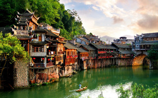 River buildings man boat scenery - the side of it free wallpaper
