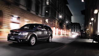 Black suv city street night 2 - a black suv free wallpaper