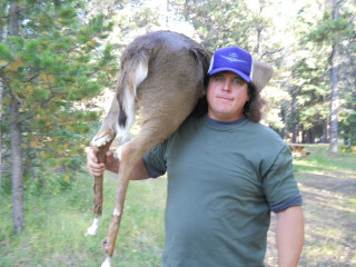 Man holding deer forest trees - a blue hat free wallpaper for desktop