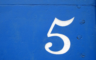 Number five painted blue wall - white paint free wallpaper