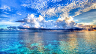 Beautiful blue ocean clouds boat 2 - free beach wallpaper for desktop