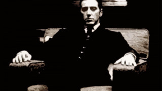 Man sitting chair hands on - a suit and tie free wallpaper for desktop