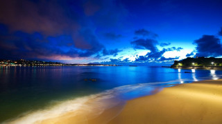 Beach water clouds night lights - a body of water free wallpaper
