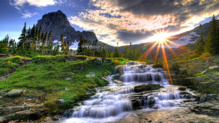 Waterfall mountain sun clouds forest - a forest below free wallpaper