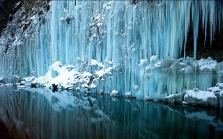 Man standing lake ice waterfall - waterfall free wallpaper