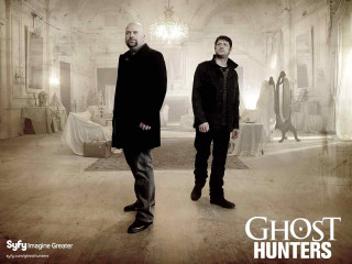 Two men ghost hunters sign - the wall behind them free wallpaper