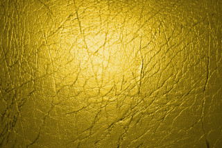 Yellow shiny surface middle spot - a yellow background free wallpaper