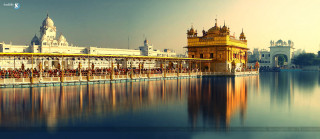 Large waterbuilding clocktower sunset cityscape - a large body of water free wallpaper